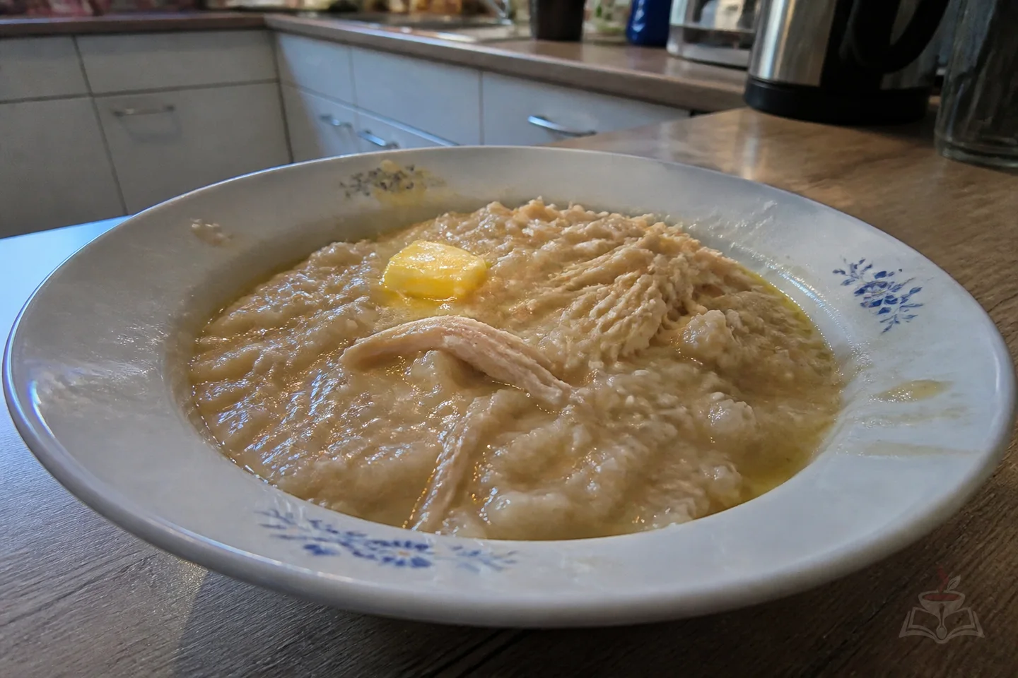 Armenian harissa wheat porridge with shredded chicken and clarified butter