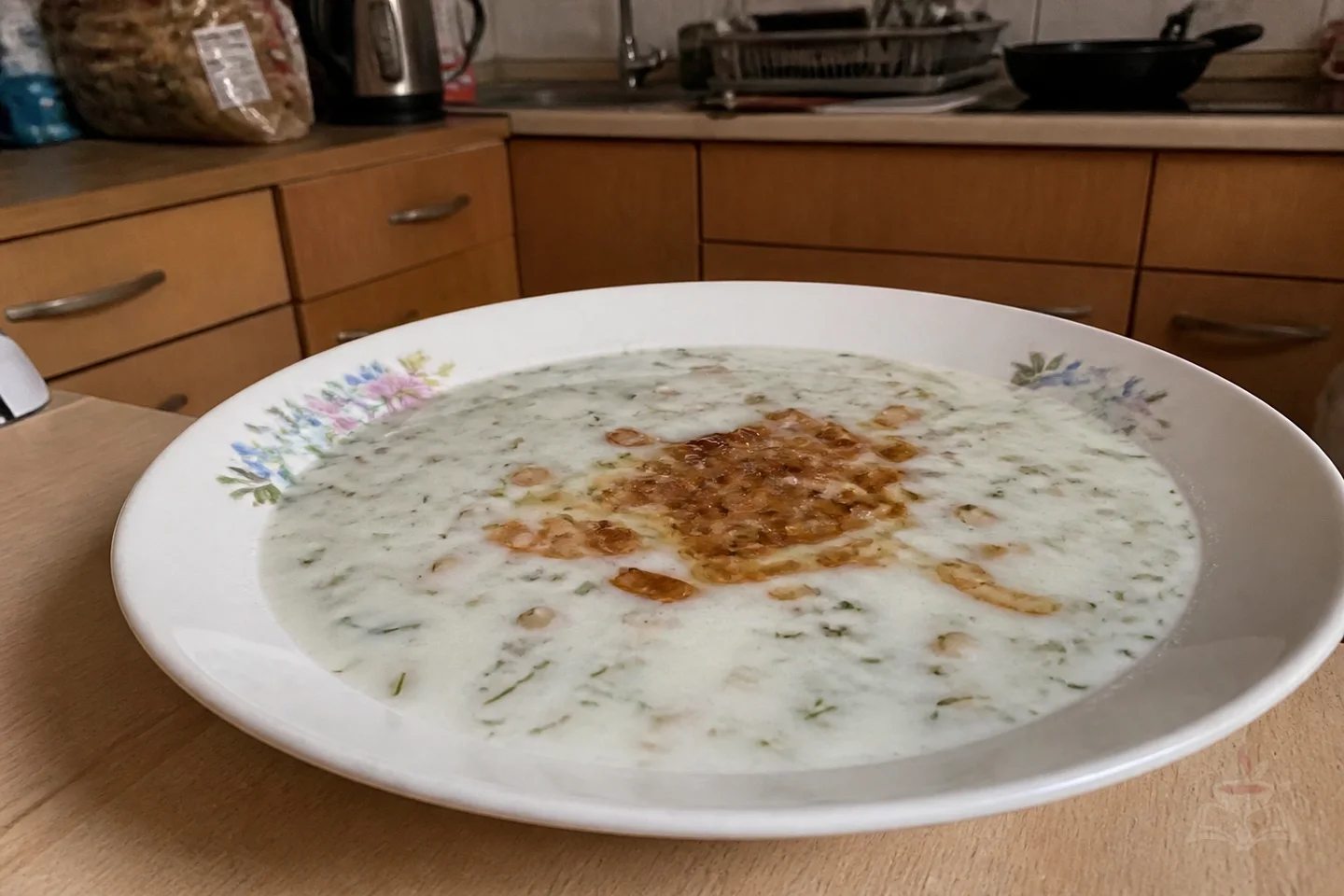 Armenian spas yogurt soup with wheat berries herbs and fried onion
