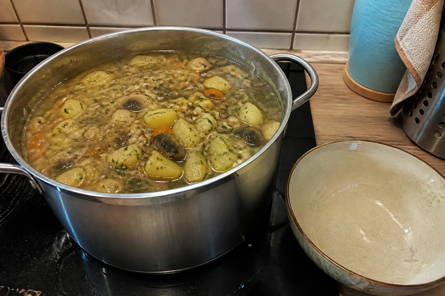 Belarusian mushroom and barley soup with potatoes, carrots, and dill