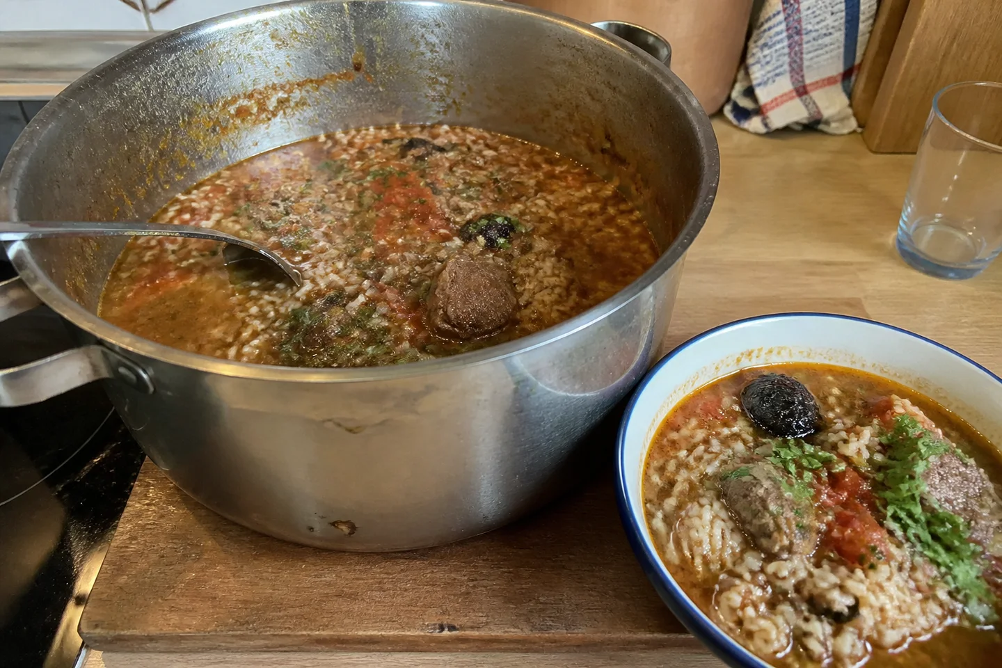 Jewish-style lamb kharcho with rice, red pepper, tomatoes, sour plums, mint, and cilantro
