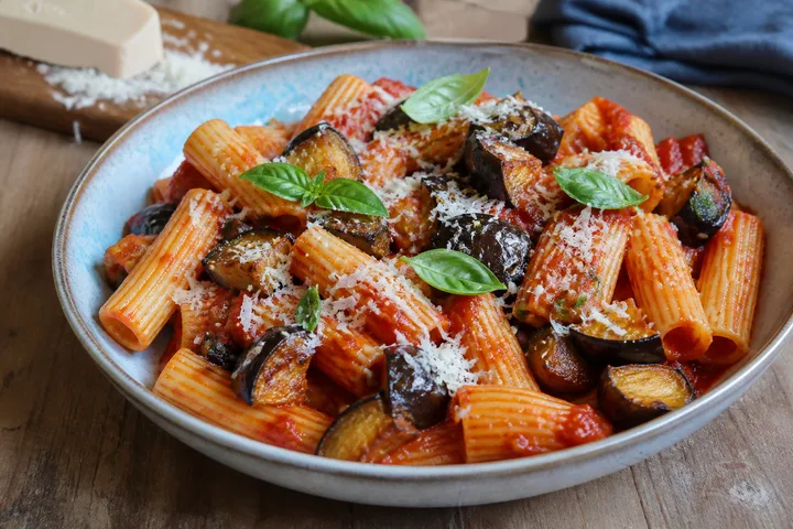 Sicilian pasta alla Norma with eggplant, tomato, basil, and ricotta salata