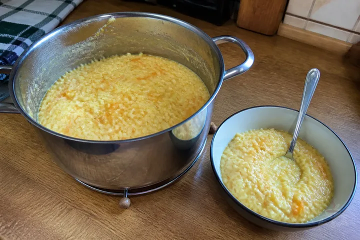 Creamy millet and pumpkin porridge with butter and pumpkin seeds