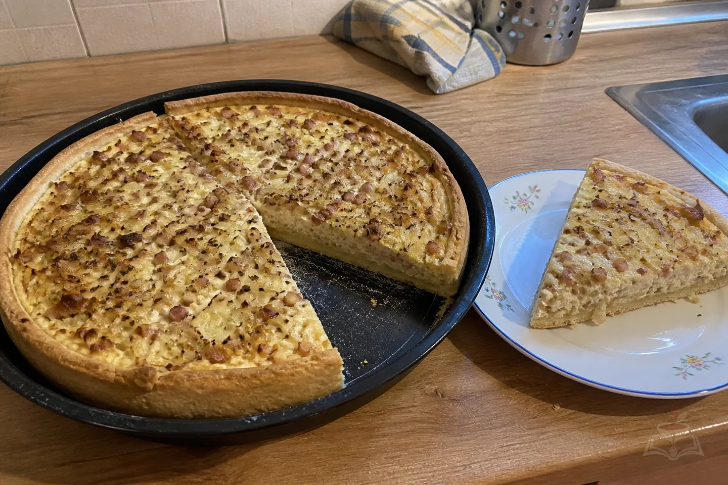 German Zwiebelkuchen onion tart with bacon, creamy filling, and a golden crust